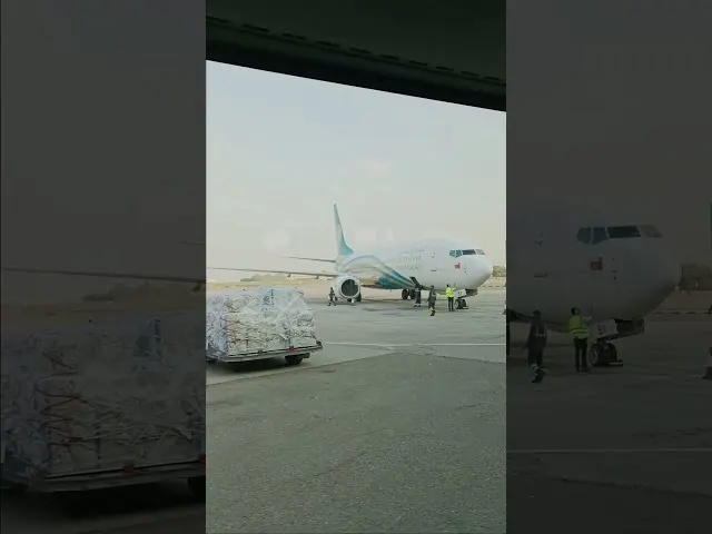 Al Jazeera Airways aircraft being loaded with cargo at airport tarmac
