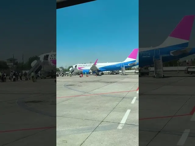 Centrum Air aircraft parked at airport tarmac with ground equipment