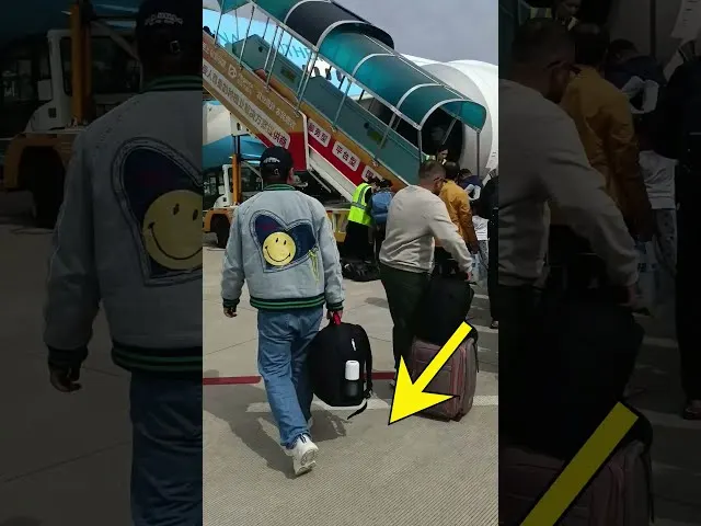 Passengers boarding China Southern Airlines aircraft at airport terminal