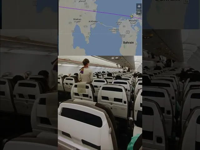 Aircraft cabin interior with empty seats and map showing Middle East route