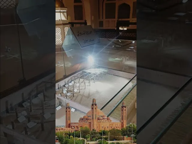 The Old Masjid Nabawi replica model inside Bahria Town Lahore showing mud brick walls and palm trunk pillars